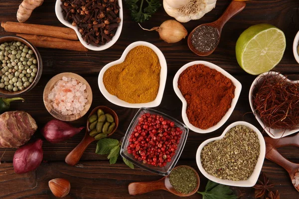 Spices and herbs on table. Food and cuisine ingredients and lemo — Stock Photo, Image