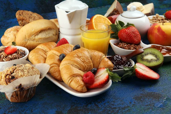 Breakfast served with coffee, orange juice, croissants, cereals — Stock Photo, Image