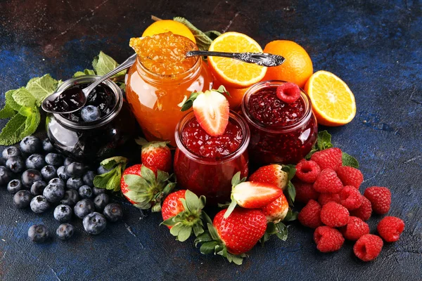 Assortment of jams, seasonal berries jelly, mint and fruits and — 스톡 사진