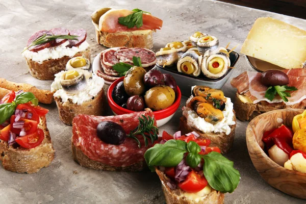 Appetizers table with italian antipasti snacks and wine in glass — Stock Photo, Image