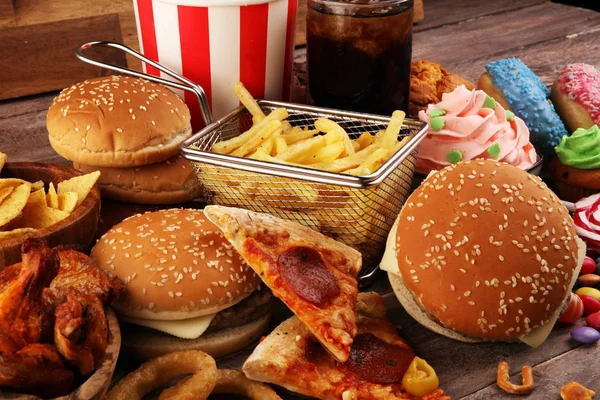 Unhealthy products. food bad for figure, skin, heart and teeth. — Stock Photo, Image