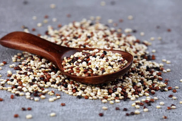 Set of quinoa Red, white and brown quinoa in a wooden spoon. hea — Stock Photo, Image