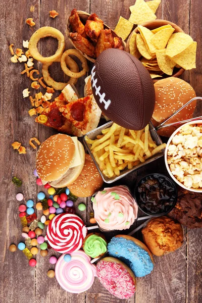 Chicken wings, fries and onion rings for football on a table. Gr — Stock Photo, Image