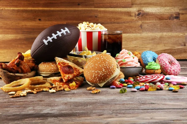 Chicken wings, fries and onion rings for football on a table. Gr — Stock Photo, Image