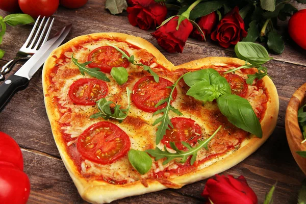 pizza Heart shaped margherita with tomatoes and mozzarella veget