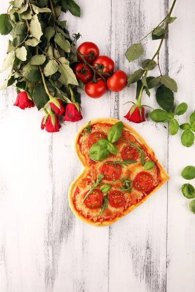pizza Heart shaped margherita with tomatoes and mozzarella veget