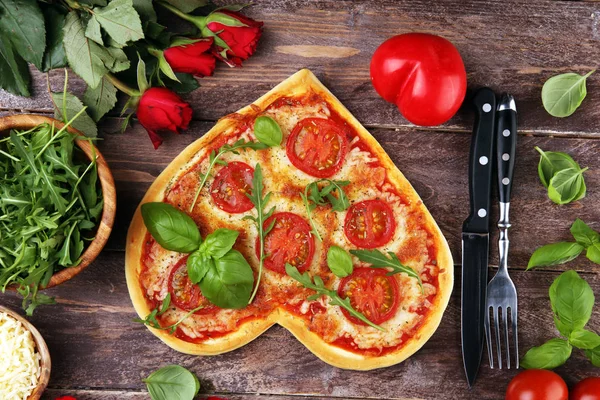 pizza Heart shaped margherita with tomatoes and mozzarella veget