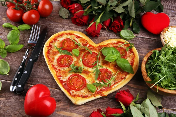 pizza Heart shaped margherita with tomatoes and mozzarella veget