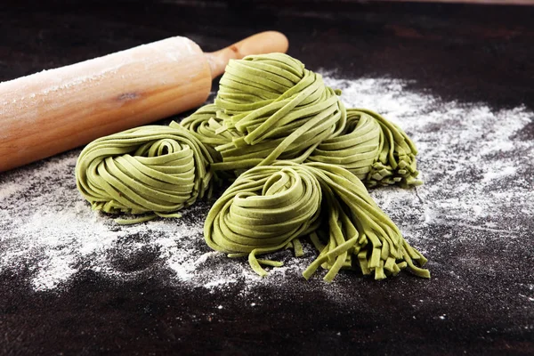 Closeup of raw homemade pasta tagliatelle. fresh italian traditi