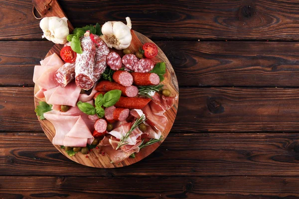 Food tray with delicious salami, pieces of sliced prosciutto cru — 스톡 사진