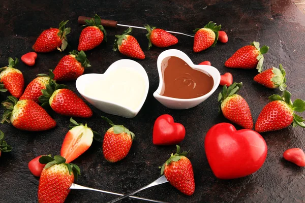 Valentine Chocolate fondue melted with fresh strawberries and da