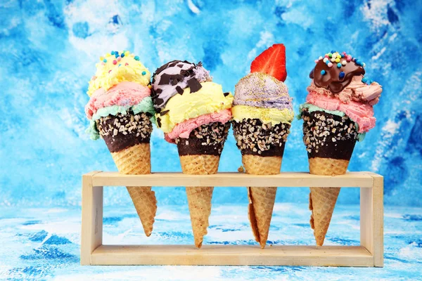 Colorful ice cream cone, rainbow jimmies, chocolate and strawber
