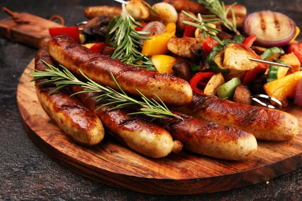 Assorted delicious grilled meat with vegetable on a barbecue wit — Stock Photo, Image