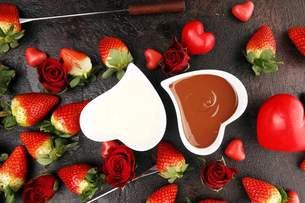 Valentine Chocolate fondue melted with fresh strawberries and da