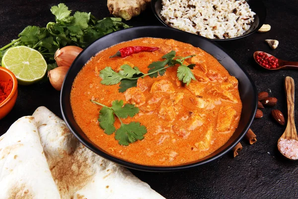 Chicken tikka masala spicy curry meat food in pot with rice and — 스톡 사진