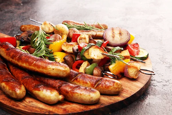 Assorted delicious grilled meat with vegetable on a barbecue wit — Stock Photo, Image