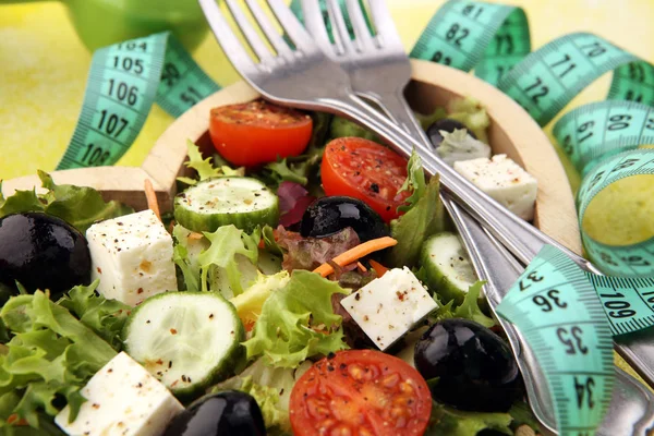 Authentic fresh salad in a wooden heart shaped cup with dumbbell — Stock Photo, Image