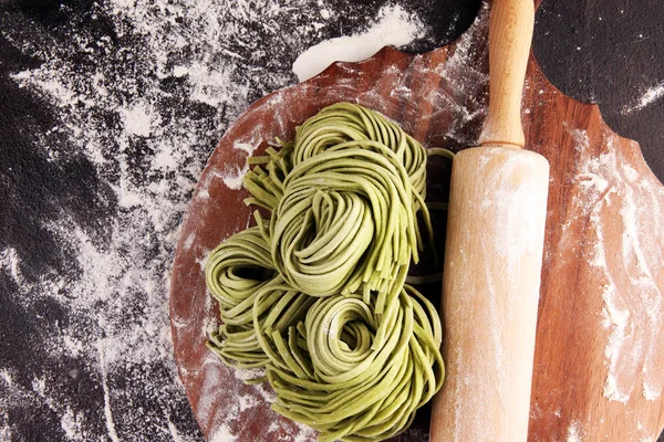 Closeup of raw homemade pasta tagliatelle. fresh italian traditi