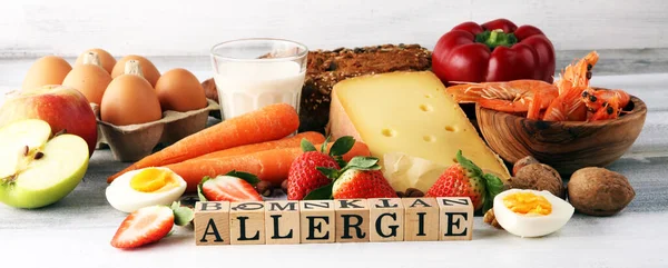 Allergy food concept. Allergy food as almonds, milk, cheese, strawberry, seeds, eggs, peanuts and