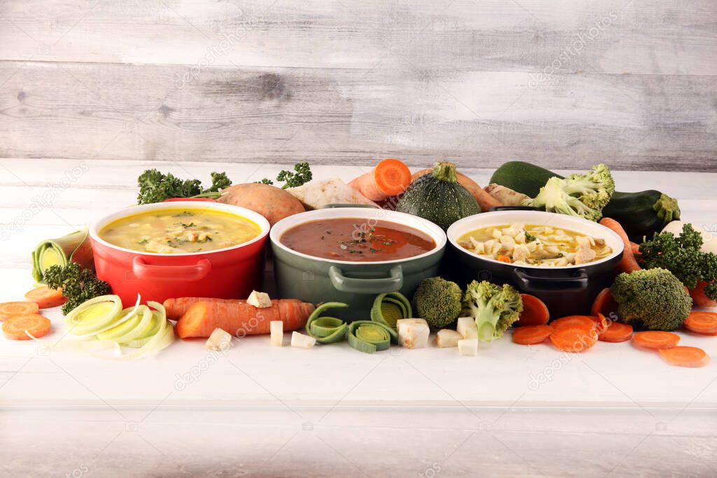 Set of three soups from worldwide cuisines, healthy food. Broth with noodles, beef soup and broth with marrow dumplings. All soups with healthy vegetables.