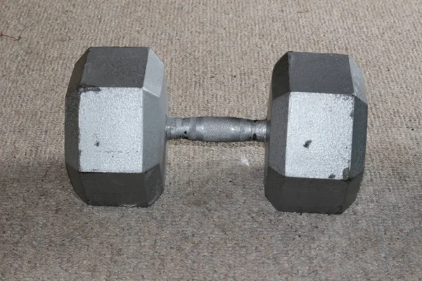 Dumbbells over CARPET background. THIS IS A 90LB DUMBBELL — Stock Photo, Image