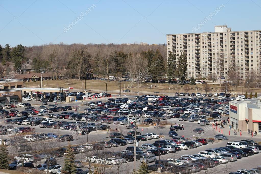 London Ontario Canada, MArch 24 2018: A full parking lot on a Saturday in a Canadian Costco location. Costco is a a huge retailer in North America known for selling bulk goods. Costco has begun