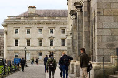 Dublin Ireland, January 18 2018: students gathering around trinity university college in Dublin Ireland. Trinity is a historic school.