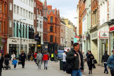 Dublin Ireland, February 19 2018: Large group of people walking on Dame St. This street is home to many business and close to Trinity.