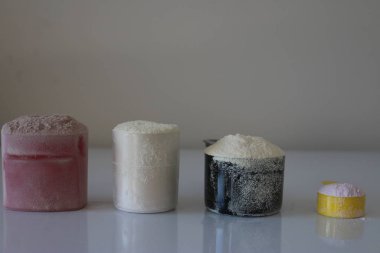 Various workout supplements lined up in a studio shot