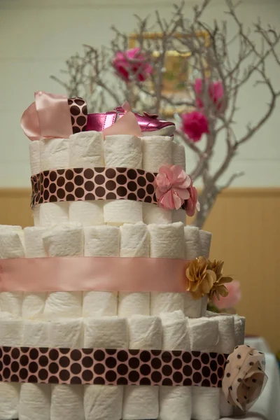 Cakes made of diapers on white — Stock Photo, Image