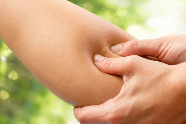 Macro detail of fingers pressing hamstring — Stock Photo, Image