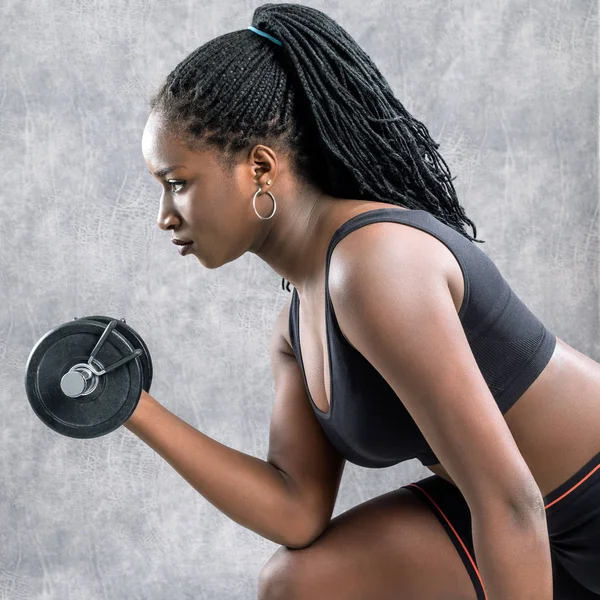 Girl working out with dumbbells — Stock Photo, Image