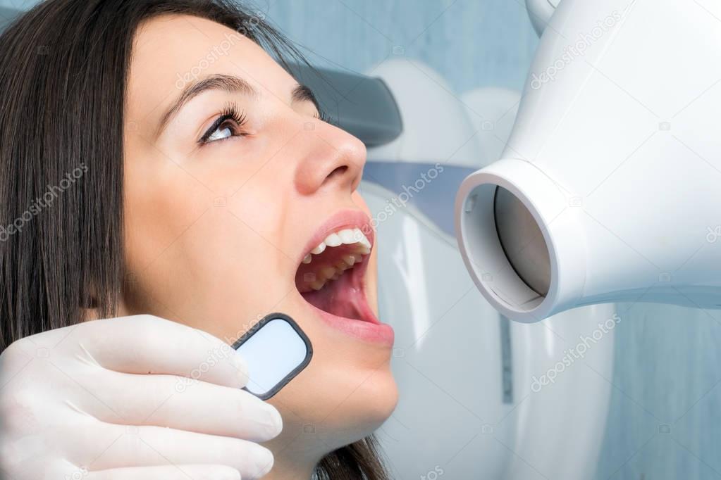 Young woman taking dental x-ray