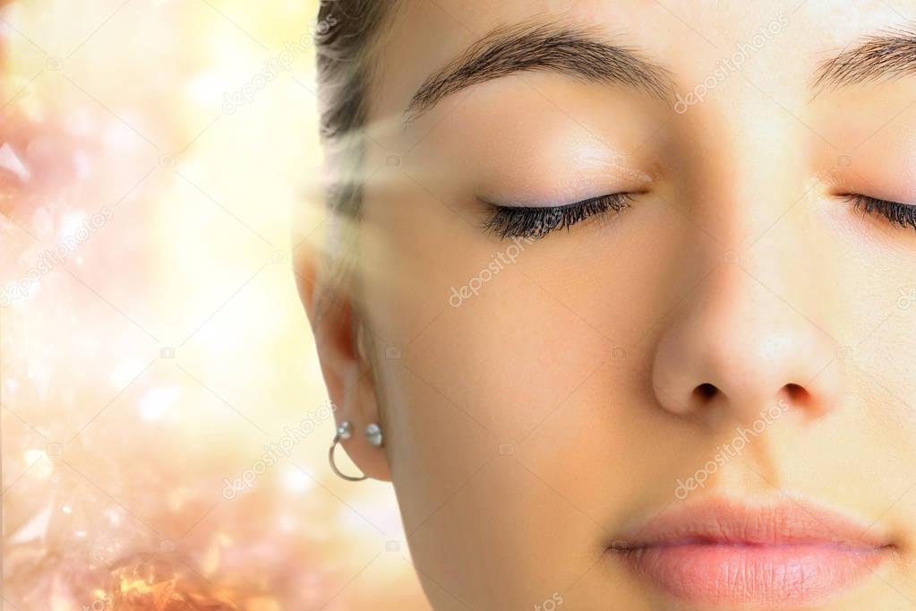 Relaxed meditating woman face 