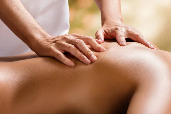 Therapist hands on female back. — Stock Photo, Image