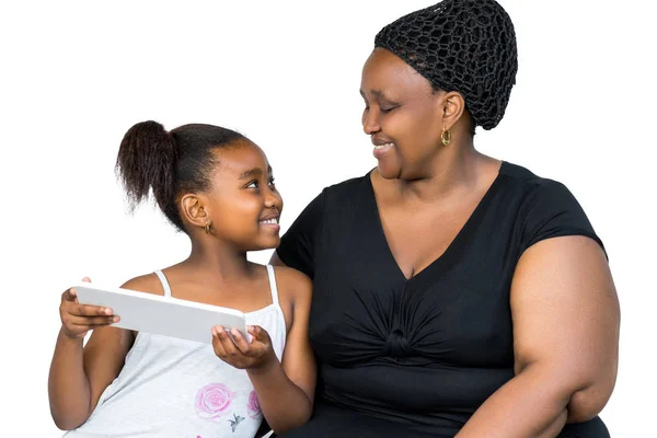 African mother and little daughter spending time together on tab — Stock Photo, Image