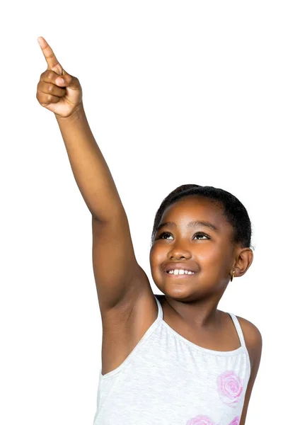 Little black girl pointing with finger at corner. — Stock Photo, Image