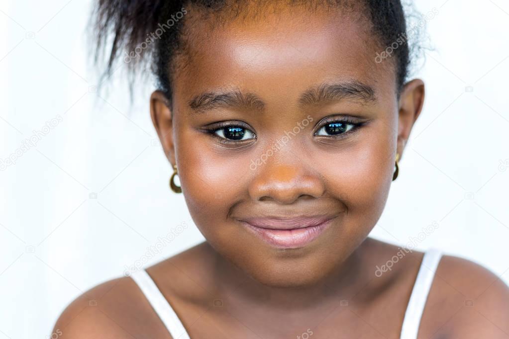 Face shot of cute little african girl.