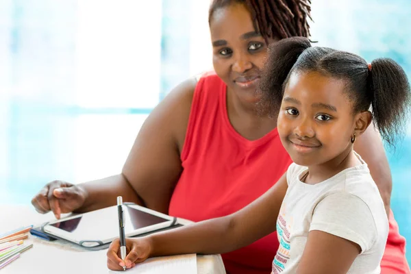 Close Portrait Little African Girl Doing School Work Mother Helping — Stock Photo, Image