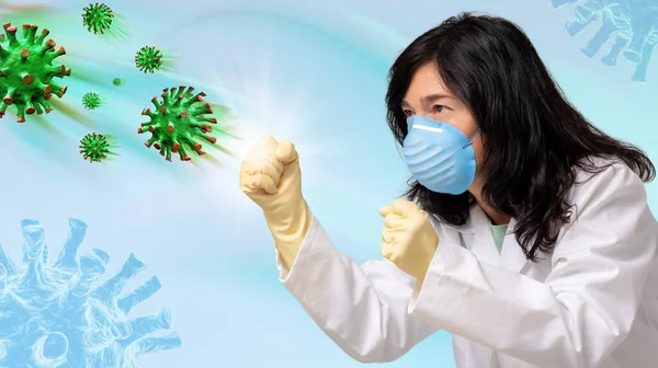 Enfeksiyonlu yeşil virüs hücrelerine karşı savaşan kadın doktorun kavramsal eğlenceli portresi. Yüzünde maske, önünde yumrukları olan lateks eldivenli bir kadın..
