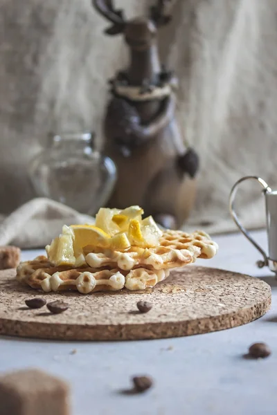 Delicious Breakfast with waffles, lemon syrup and coffee