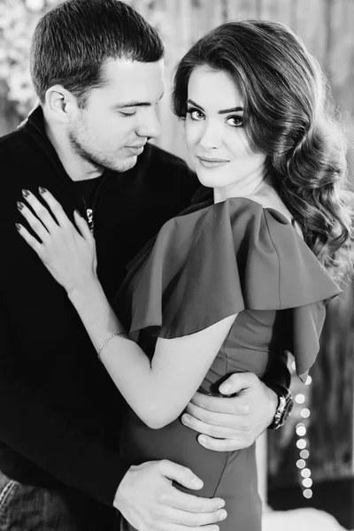 Sexy look of a elegant rich woman hugged by her husband — Stock Photo, Image