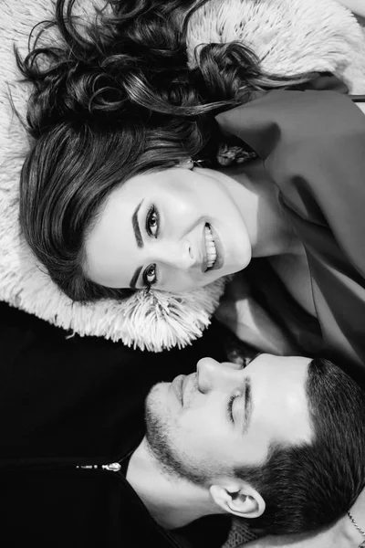 Man looking at his gorgeous wife lying on the bed — Stock Photo, Image