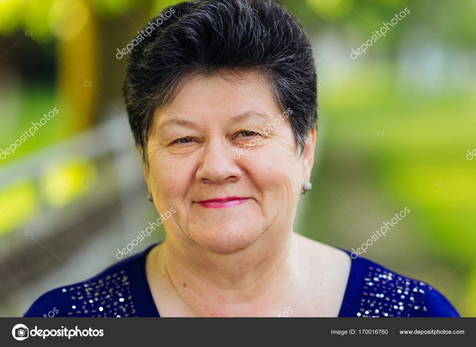 Plump old woman with black hair smiling and looking into the cam Stock  Photo by ©ivankyryk 170016760