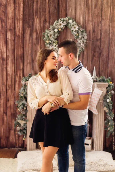 Attractive young couple spend time at the fireplace — Stock Photo, Image