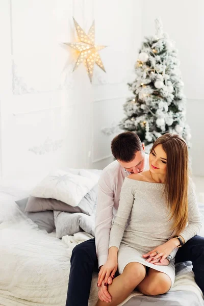 Hot kiss of a lovers of a young couple in the festive atmosphere