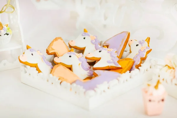 biscuit in the form of animals of bright shades, placed in a white box