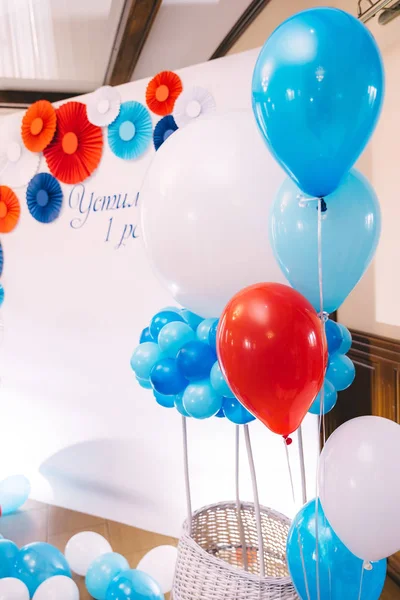 beautiful white photo zone with colored balloons for baby boy. f