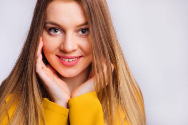 beautiful girl with freckles and gentle makeup looking at camera