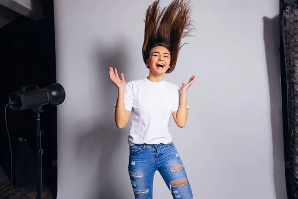 Stylish girl jumps and have fun on white background. studio phot — 스톡 사진